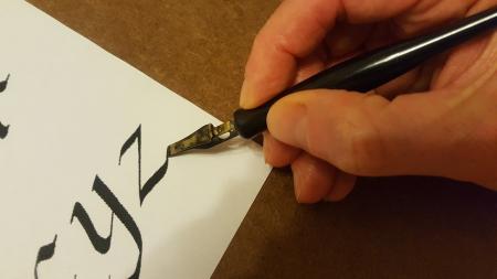 hand doing calligraphy